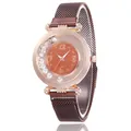 Rose gold quartz watch with orange starry dial and moving crystals on mesh strap - Coffee