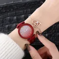 Detail of red starry dial ladies watch paired with a rose gold heart-shaped bracelet - Watch+Bracelet / Red