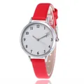 Minimalist women's quartz watch with red leather strap and heart pattern on white dial - Red