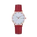 Close-up of rose gold watch face with crystal markers and red leather textured strap - Red