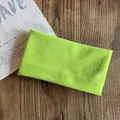Detail shot of the neon green knitted headband with high elasticity for sports and fitness - Fluorescent Green