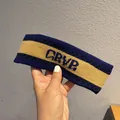 Detail of navy knit headband with yellow stripe and woven CRVP lettering texture - Khaki + Navy Blue