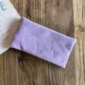 Detailed knit texture of a light purple minimalist headband on a wooden background - Light Purple