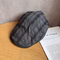 Close-up of dark grey plaid fabric texture on a retro newsboy cap with neat stitching - M / Dark Gray and Black Plaid