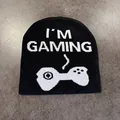 Detail of the black knit beanie featuring white I'M GAMING jacquard text and controller - M (54-58cm) / Black