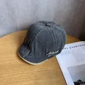 Detail view of dark grey washed cotton beret with white Natural letter embroidery - M (55-60cm) / Charcoal Black