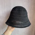 Close-up of black hollow knit bucket hat showing detailed breathable crochet pattern - M (55-58cm) / Black