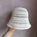Close-up of hand-crocheted white bucket hat with breathable hollow lace texture - M (55-58cm) / White