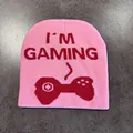 Detail of pink knitted beanie with red I'M GAMING text and controller jacquard pattern - M (54-58cm) / Pink