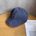 Detail of vintage blue washed denim ivy cap with red stitching and Natural embroidery - M (55-60cm) / Navy Blue