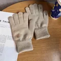 Detail of oatmeal knit gloves showing bear embroidery and touch screen finger slit - One Size / Beige