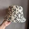 Detailed close-up of corduroy floral bucket hat fabric with delicate flower patterns - Size M (55-59cm) / Beige