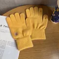 Detail of ginger yellow knit gloves with bear embroidery and touch-screen finger openings - One Size / Yellow