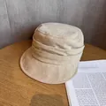 Detailed close-up of beige suede bucket hat featuring elegant pleated band and soft texture - M (55-59cm) / Beige