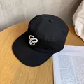 Detailed macro view of white 3D embroidery on a black vintage flat top cotton army cap - M / Black