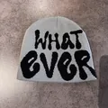 Detail of grey knitted beanie featuring black graffiti WHAT EVER jacquard lettering - M (54-59cm) / Gray