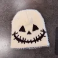 Detail of soft cream faux fur knit beanie with black Halloween ghost face embroidery - M (54-59cm) / Beige