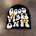 Detail of knitted beanie showing Good Vibes Only text and melting smiley face graphics - M / Black