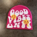 Detail view of pink beanie knit texture with Good Vibes Only text and melting smiley face - M / Rose Red