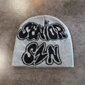 Detailed close-up of grey knit beanie with black SENIOR SZN jacquard text and stars - M / Gray
