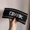 Detail of a black knitted headband featuring white CRANK logo and diamond patterns - Black