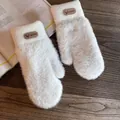 Detail of white plush winter mittens with knitted cuffs and reindeer leather patch - One Size / White