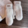 Detail of plush thermal gloves with elastic ribbed cuffs and embossed brand label - One Size / Beige