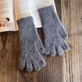Detailed view of grey plush knit gloves with soft faux fur texture on a wooden table - One Size / Dark Gray