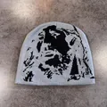 Close-up of light grey knit beanie featuring a black pixelated portrait pattern texture - M / Gray