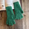 Detail of dark green plush knit gloves with fuzzy texture on a wooden desk setting - One Size / Dark Green