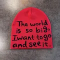Detailed knit texture and black lettering on a red beanie hat for winter warmth - Red
