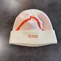 Detail of cream knit beanie featuring colorful geometric patterns and orange embroidery - M (55-59cm) / Off White