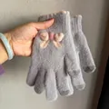 Detail of grey knitted gloves with pink bow and touchscreen fingertips for women - Gray