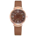 Detailed macro view of the rose gold rhinestone case and brown leather strap watch - Wave Pattern Dark Brown