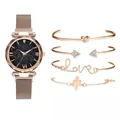 Detail of rose gold mesh watch with starry blue dial and four assorted charm bracelets - Watch And Bracelet / Rose Gold