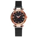 Detail of rose gold quartz watch with diamond-cut glass and black starry sky dial - Single Watch / Black