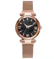 Detail of rose gold mesh watch with starry blue dial and faceted geometric glass face - Single Watch / Rose Gold