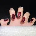 Deep red cat eye press-on nails with sparkling firework design and a square-oval shape - Small (S)