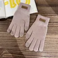 Close-up of knit gloves featuring leather fashion patch and touchscreen fingertips - One Size / Khaki