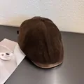 Close-up of vintage brown corduroy beret hat with premium leather brim and stitching - M / Coffee
