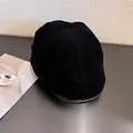 Detail view showing black corduroy texture and 6-panel stitching on vintage newsboy cap - M / Black