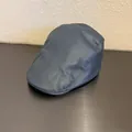 Detail showing the fine pebble grain texture and precise stitching of the dark blue PU ivy cap - Blue