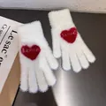 Close-up of white plush gloves with red heart pattern and LOVE text for winter warmth - One Size / White