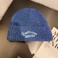 Detailed view of dark blue knit beanie with white embroidered Bestchoise lettering - M (55-59cm) / Sapphire Blue