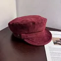 Detail of burgundy faux suede newsboy cap featuring vintage metal button and texture - M (55-59cm) / Burgundy