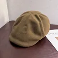 Close-up of premium dark camel wool newsboy hat with refined stitching and warm texture - M / Khaki