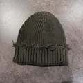 Dettaglio del berretto in maglia verde militare con trama a nido d'ape e frange - M (54-59cm) / Verde Militare