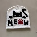 Detail of white knit beanie with pixel cat pattern and MEOW text embroidery - M (52-59) / White