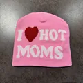 Detail of pink knitted beanie featuring white I heart hot moms jacquard pattern - I ❤️ HOT MOMS Style / Pink