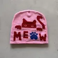 Detail of pink knitted beanie featuring a red cat silhouette and MEOW text with paw print - M (52-59) / Pink